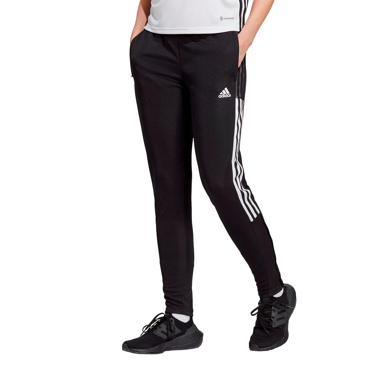 Can I easily slip on the women's adidas tiro 21 training pants over trainers and cleats?